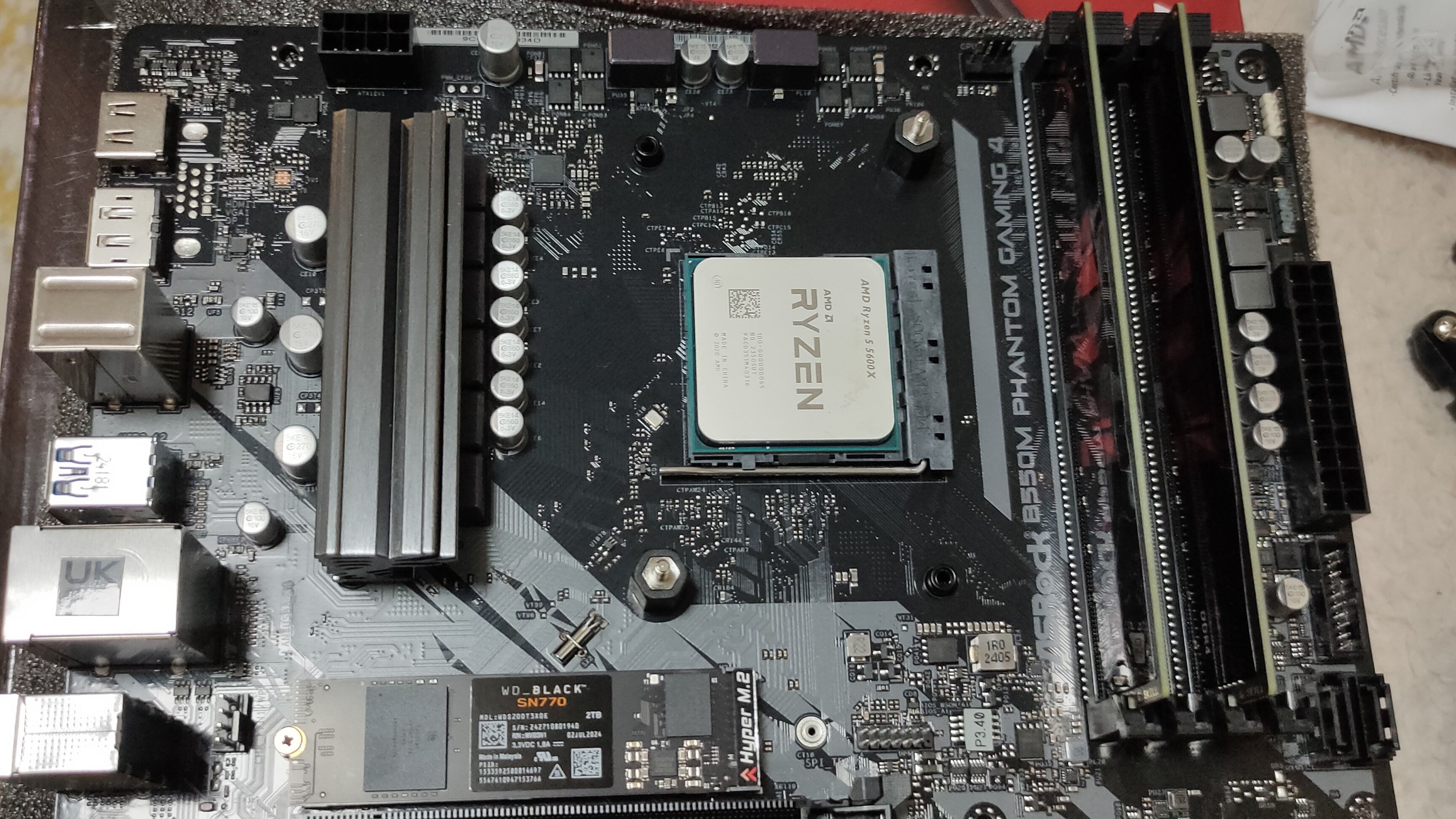 PBO on AMD CPUs: Discover the secret to getting the most out of it! A Ryzen 5 5600X CPU inside a B550M motherboard with some DDR4 RAM and an NVMe SSD.