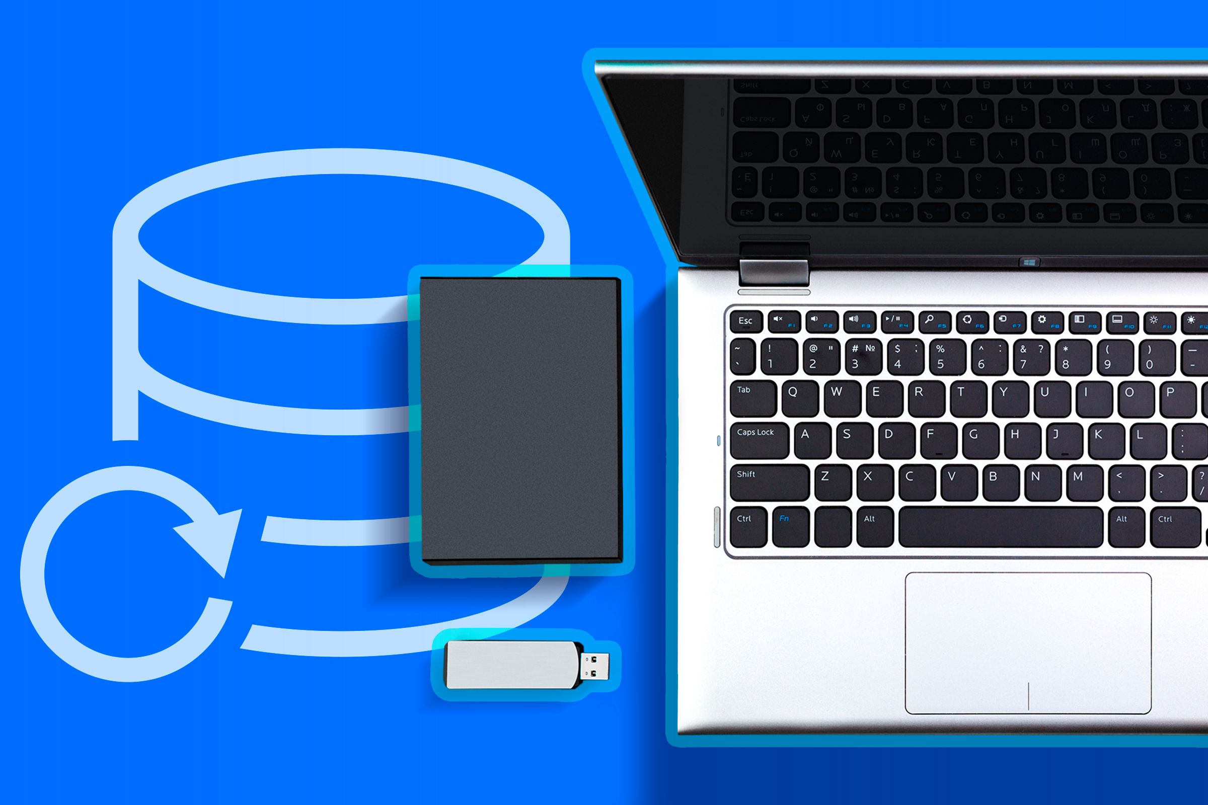사용자 경험을 향상시키는 Ubuntu 설정: 7가지 비밀 배우기 25 Una laptop con un disco USB y un disco duro externo al lado, junto a un ícono de copia de seguridad.
