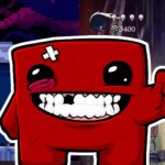 Juegos que comenzaron como juegos en Flash - Personaje rojo de Super Meat Boy sonriente con pulgar arriba, frente a fondo de juegos indies como Hollow Knight y plataformas pixel art, para artículo "13 grandes juegos que no creerás que empezaron como juegos pequeños".