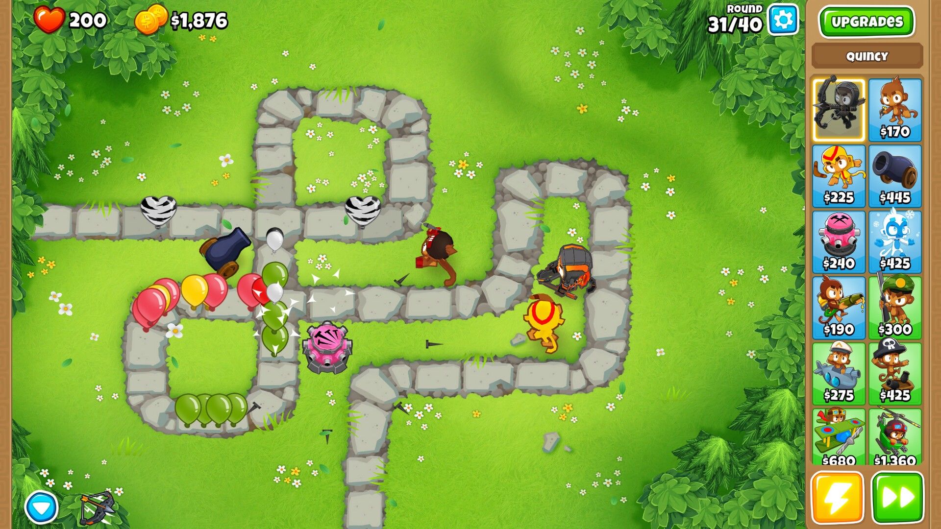 Defending their area with multiple monkeys in Bloons TD 6.