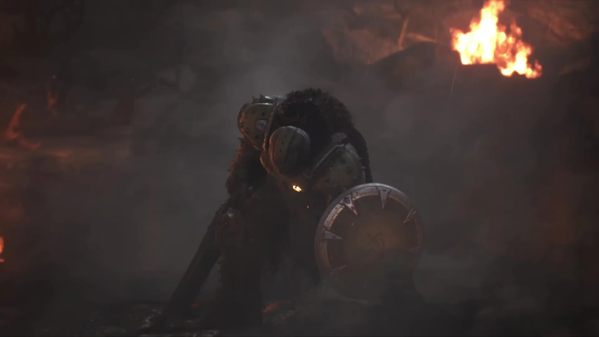 Doom-Zeitleiste – Ein mittelalterlicher Krieger in schwerer Rüstung und mit Runenschild kniet inmitten von Rauch und Feuer in Doom: The Dark Ages und illustriert die düstere Atmosphäre und die Hintergrundgeschichte des Spiels Doom.