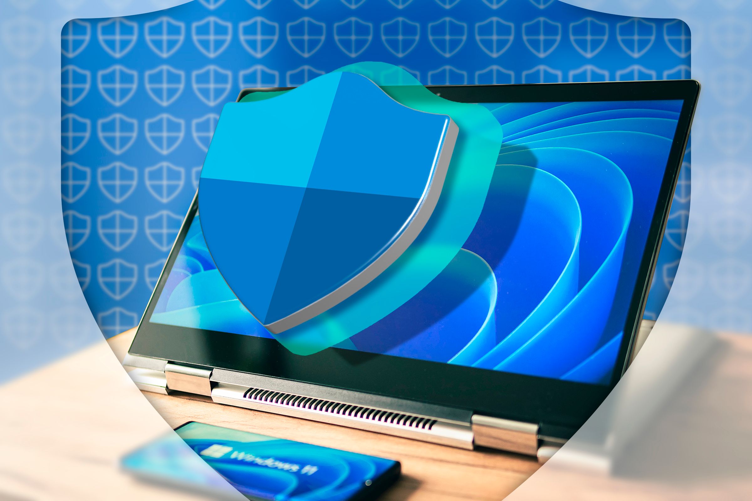 Laptop mit Windows 11 und Windows Defender-Logo auf dem Bildschirm.