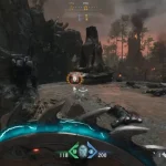 Cañones Doom The Dark Ages - Gameplay de Doom: The Dark Ages; el Slayer en primera persona avanza entre ruinas ardientes y cañones medievales con el escudo‑sierra activo.