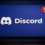 ข้อผิดพลาด Discord No Route: 6 วิธีแก้ไขด่วน ⚡️ ไม่มีข้อผิดพลาดเส้นทางใน Discord - โลโก้ Discord บนหน้าจอสีน้ำเงินพร้อมป้ายแจ้งเตือนเครื่องหมายอัศเจรีย์สีแดง แสดงถึงการแจ้งเตือนแอปแชทหรือปัญหาบนหน้าจอเดสก์ท็อป