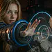 Pragmata Lunar - Young woman in a futuristic blue spacesuit using a glowing holographic interface in sci‑fi setting - Pragmata Lunar themed space adventure artwork.